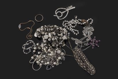Set of white metal costume jewelry including...