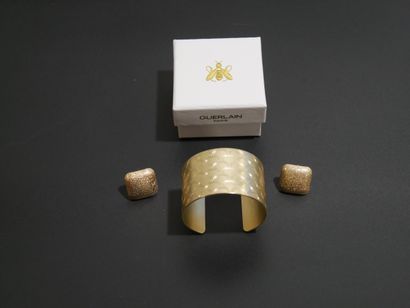 Guerlain Paris cuff bracelet in gilded metal...