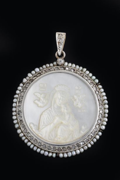 Large white mother-of-pearl medal depicting...