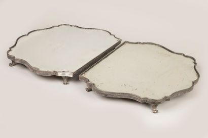 A two-part table top in silvered bronze with...
