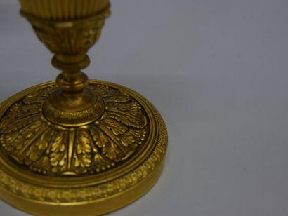 Pair of chased ormolu torches with foliage...