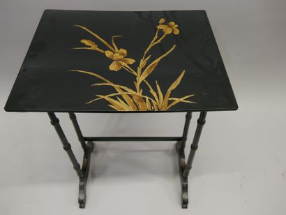 Three nesting tables in blackened wood decorated...