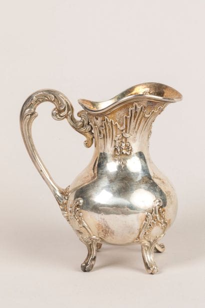 Four-legged silver creamer in the rocaille...