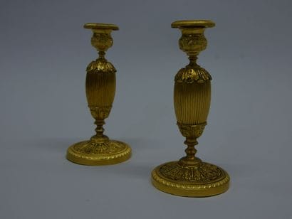 Pair of chased ormolu torches with foliage...