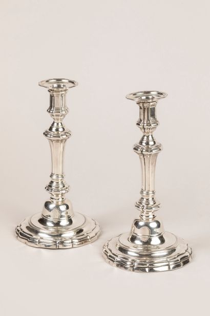 Pair of 800°/°° silver torches on a curved...