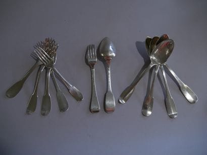 Set of five spoons and six forks in plain...