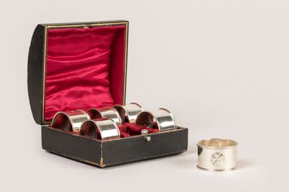 Six silver napkin rings decorated with the...