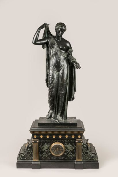 Patinated, gilded and engraved bronze clock...