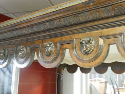 a single-headed canopy bed decorated with...