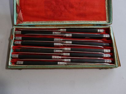 12 knives, silver blade, blackened wooden...