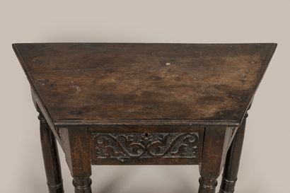 a trapezoid console, opening with a drawer...