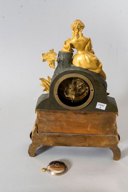 Bronze clock with two patinas depicting a...