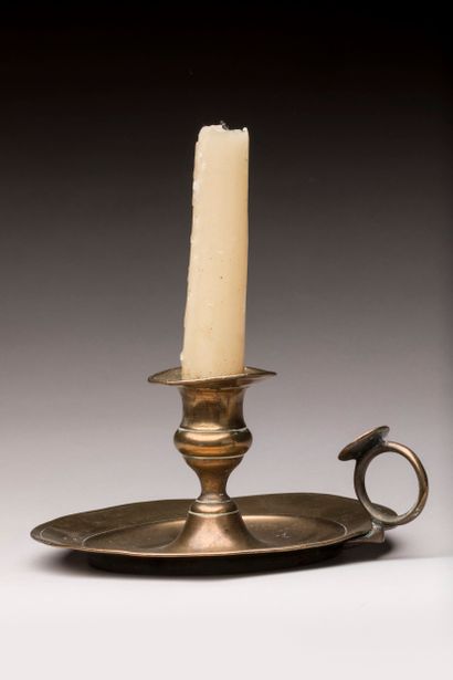 Yellow copper hand candlestick with thumb...