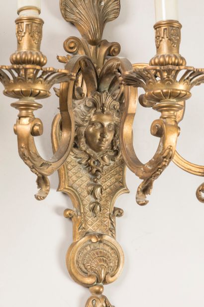 Pair of ormolu three-light sconces, the base...
