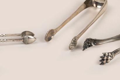 Three sugar tongs in silver 950°/°°. 
Minever...