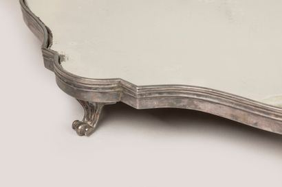 A two-part table top in silvered bronze with...