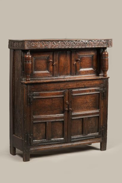 a credenza opening with four leaves, the...