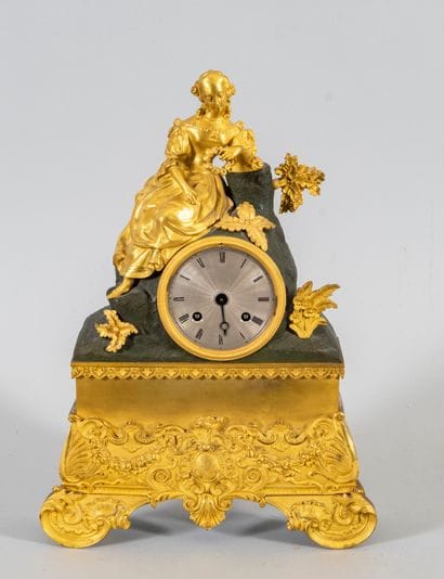 Bronze clock with two patinas depicting a...