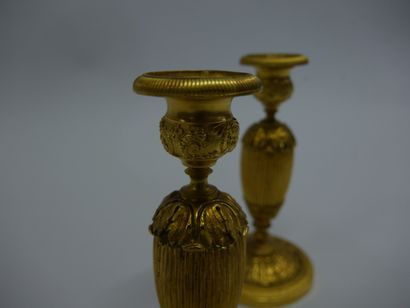 Pair of chased ormolu torches with foliage...