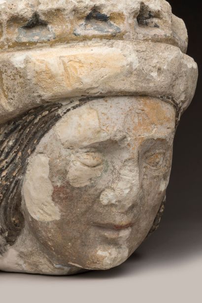 Crowned man's head in limestone (tufa), carved...