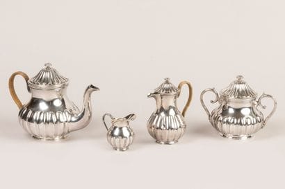 Part of a 950°/°° silver tea service with...