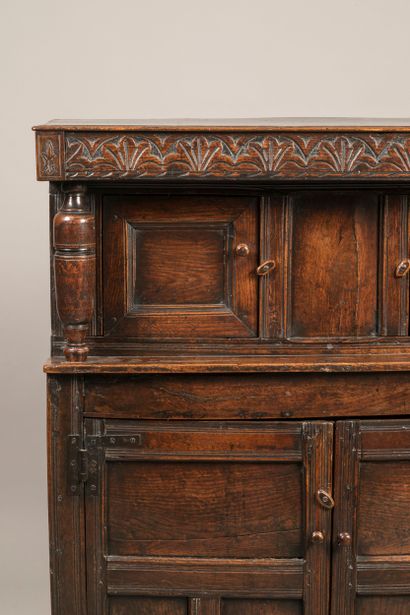 a credenza opening with four leaves, the...