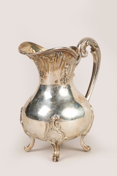 Four-legged silver creamer in the rocaille...