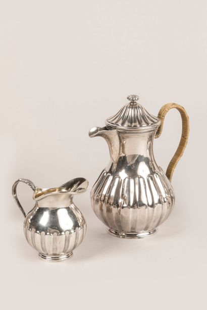 Part of a 950°/°° silver tea service with...