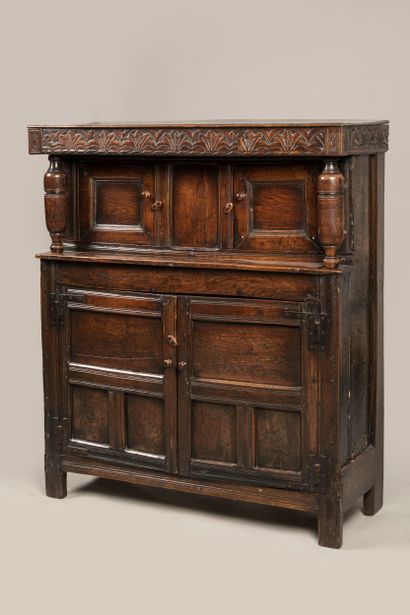 a credenza opening with four leaves, the...