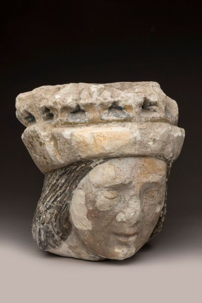 Crowned man's head in limestone (tufa), carved...