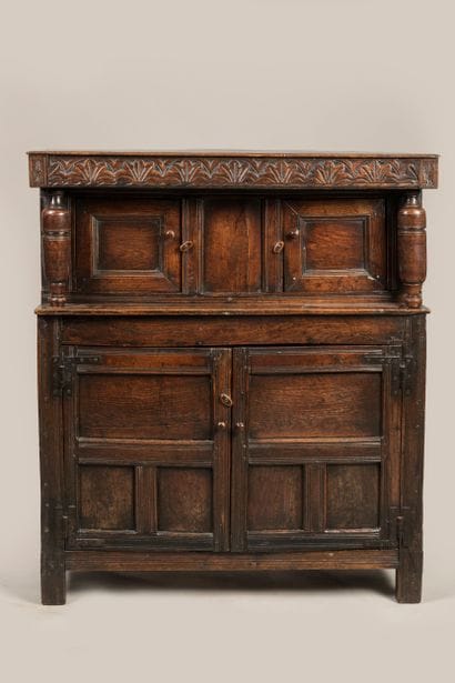 a credenza opening with four leaves, the...