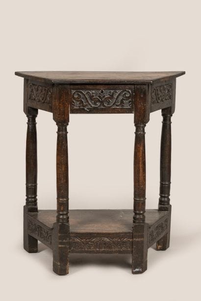 a trapezoid console, opening with a drawer...