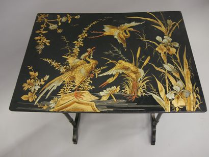 Three nesting tables in blackened wood decorated...