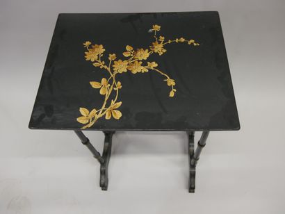 Three nesting tables in blackened wood decorated...
