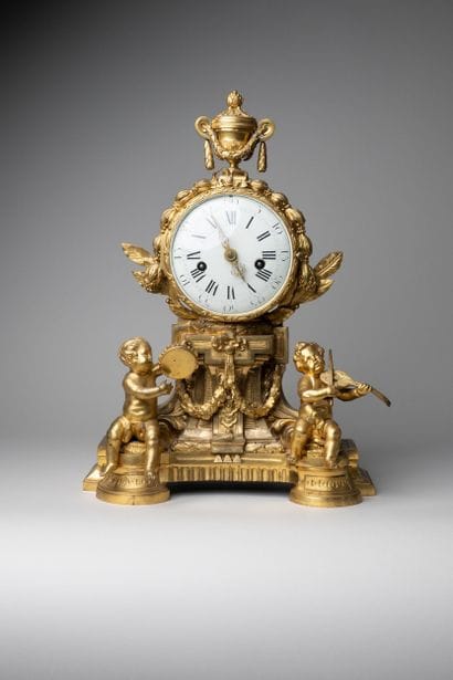 Child musician clock in chased and gilded...