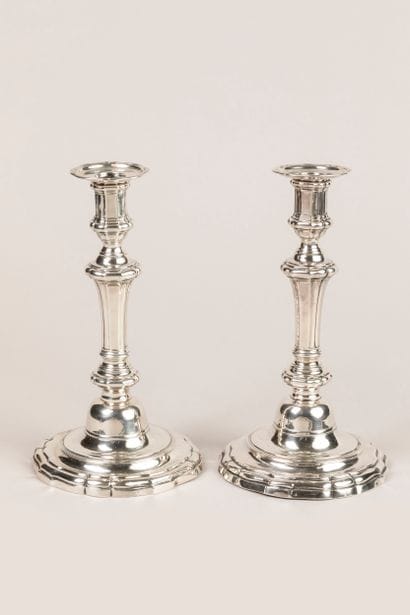 Pair of 800°/°° silver torches on a curved...