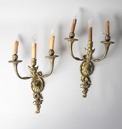 Pair of three-light snake sconces in chased...