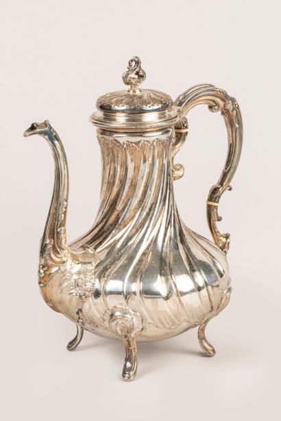 Four-legged silver coffee pot decorated with...