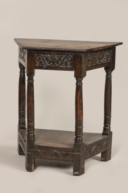 a trapezoid console, opening with a drawer...