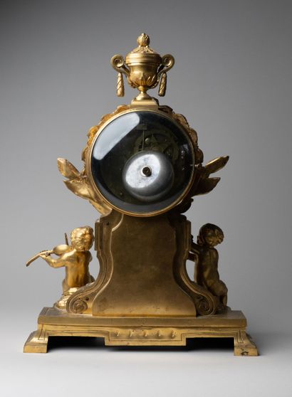 Child musician clock in chased and gilded...