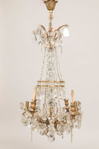 Eight-arm gilt bronze chandelier with tassels...