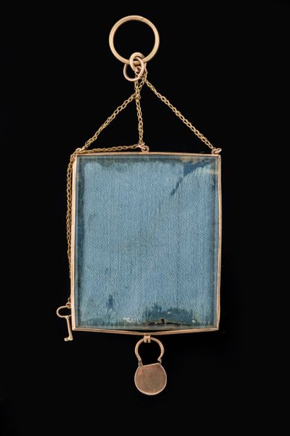Pendant adorned with a scene of a woman with...