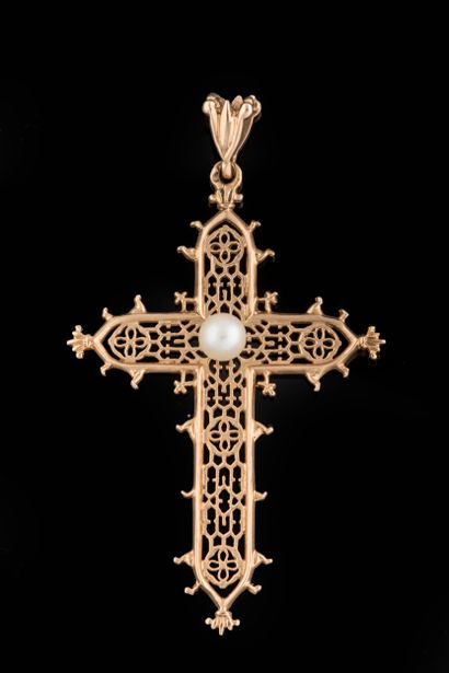 Worked cross centered with a white cultured...