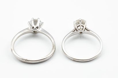 Two solitaire rings set with imitation stones:...