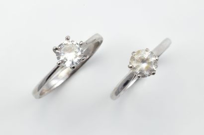 Two solitaire rings set with imitation stones:...