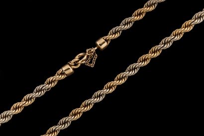 Twisted necklace adorned with a yellow and...