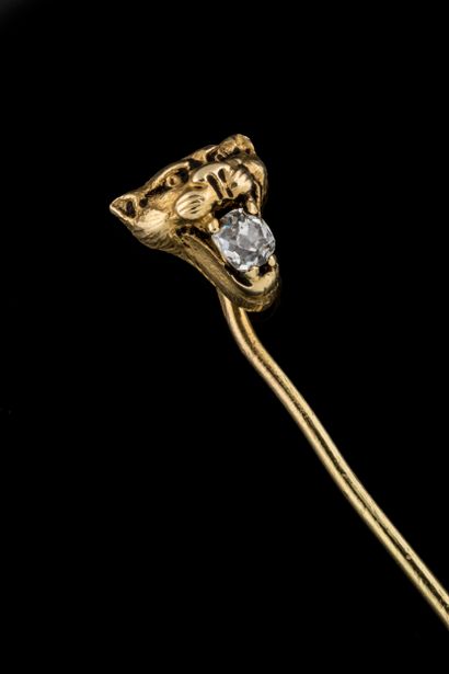 Tie pin with gargoyle or tiger head holding...