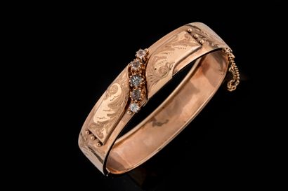 Opening bangle bracelet centered with colorless...