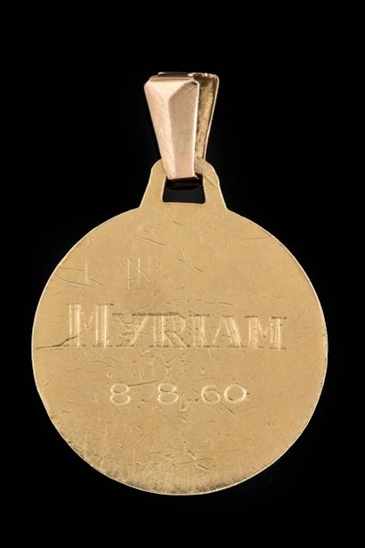 Profile medal of a virgin with veil and lily...