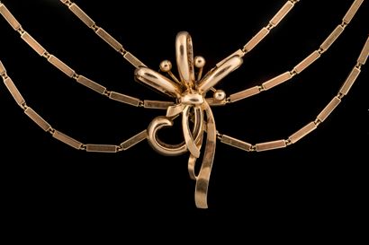 Drapery necklace adorned with a bow-shaped...